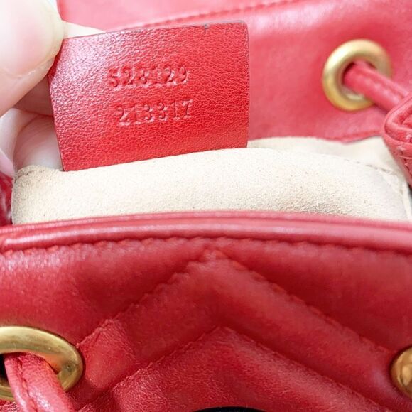 Gucci Marmont Metallasse Quilted Chevron Leather Drawstring Backpack Mini GG Red